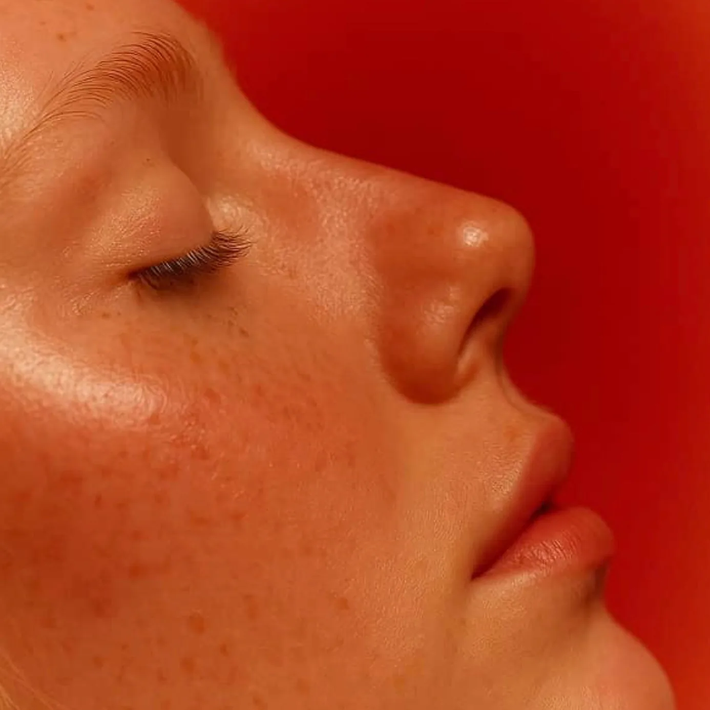 Red light glowing on a face